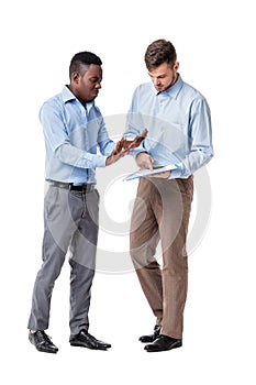 African-American and Caucasian businessman looking at documents