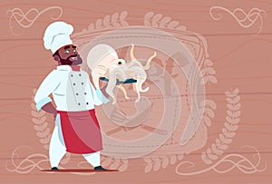 African American Chef Cook Hold Octopus Smiling Cartoon Restaurant Chief In White Uniform Over Wooden Textured
