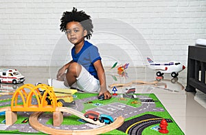 African American child play toy at home