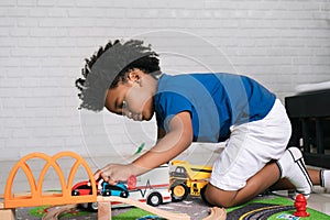 African American child play toy at home
