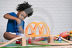 African American child play toy at home