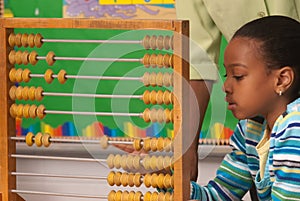 African-American child using a abacus