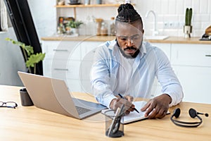 African American confident businessman using laptop computer working from home Remote work concept