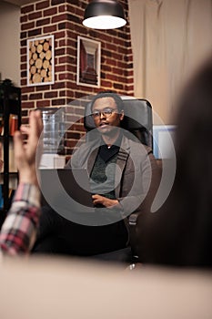 African american counselor listening to partners at couple therapy session