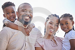 African american couple carrying their little kids outside. Adorable little brother and sister enjoying free time with