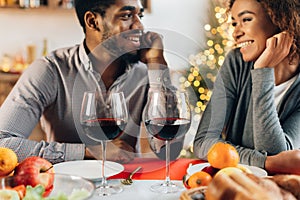 African-american couple enjoying romantic dinner at home