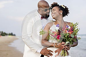 African American couple getting married at an island