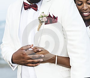 African American couple getting married at an island