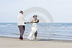 African American couple getting married at an island