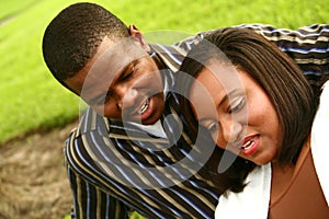 African American Couple Looking To The Bottom Outd