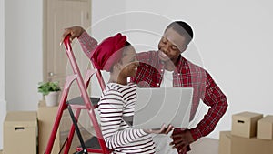 African American Couple Moving House Video Calling On Laptop Indoors