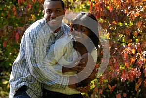 African-American couple play football