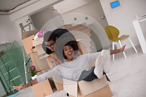 African American couple playing with packing material