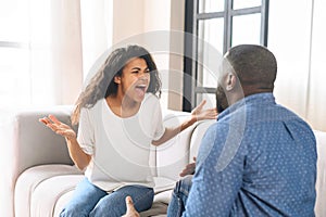 African-American couple arguing at home