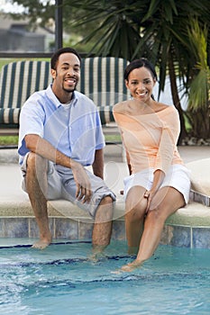 African American Couple By Swimming Pool