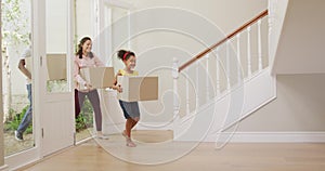 African American couple and their daughter moving into new house