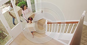 African American couple and their daughter moving into new house