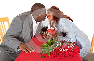 African American Couple About to Kiss in Romantic Dinner