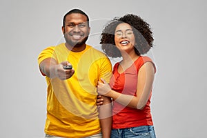 African american couple with tv remote control