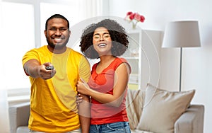 African american couple with tv remote control