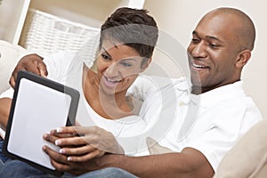 African American Couple Using Tablet Computer