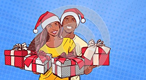 African American Couple Wearing Santa Hats Hold Presents Happy Man And Woman Over Comic Pop Art Background