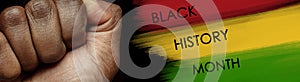 African-american culture. Racial equality. Male fist over red yellow green colors. Black History Month.