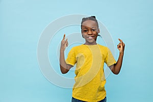 African american cute boy looking excited and contented photo