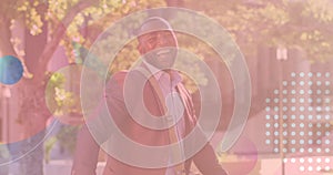 African American cyclist/enthusiast, middle-aged, laughing outdoors photo