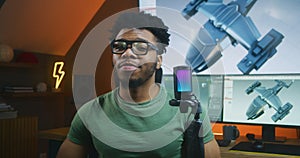 African American 3D designer records video about 3D animation