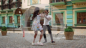 African american dancers performing in city. Couple dancing on street