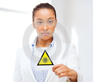 African american doctor with coronavirus sign