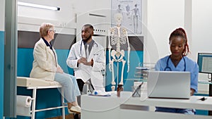 African american doctor doing consultation with senior woman
