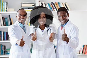 African american doctor and general practitioner and nurse as medical team photo