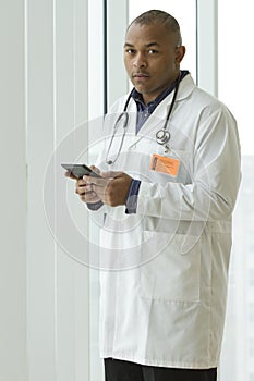 African American doctor holding tablet