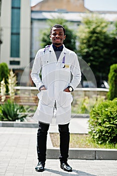 African american doctor male at lab coat with stethoscope outdoor