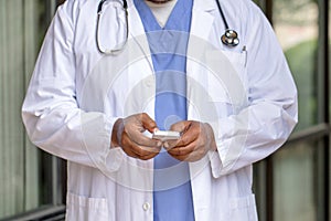 African American Doctor Texting