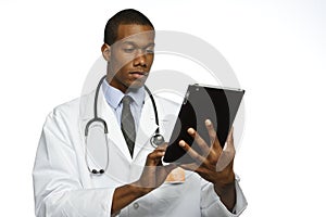 African American doctor using electronic tablet, horizontal