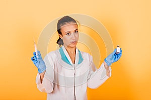 African-American doctor woman, mask, stethoskope, robe, vaccine