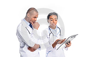 african american doctors in white coats with stethoscopes and diagnosis, photo