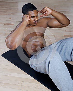 African american doing sit ups and crunches