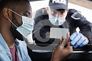 African american driver in medical mask