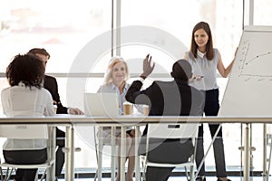 African American employee ask question to female coach at briefing