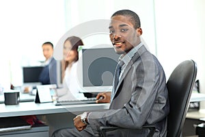 African American entrepreneur displaying computer laptop in office