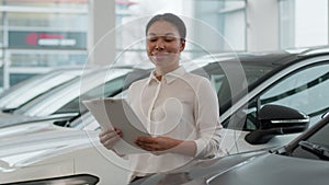 African American ethnic woman saleswoman seller consultant dealer car agent help to choose automobile in dealership