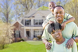 African American Family In Front of Beautiful House