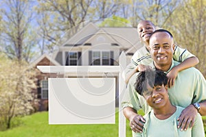 African American Family In Front of Blank Real Estate Sign and H