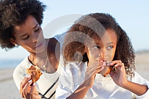 African American family on picnic on beach