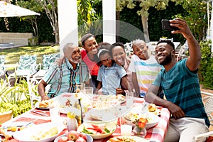 African American family taking a selfie in the garden