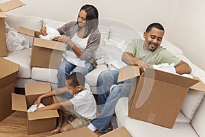 African American Family Unpacking Boxes Moving House